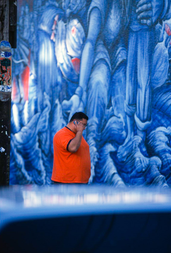 Feb05 5 13 Mission mural 2 Orange cell phone man